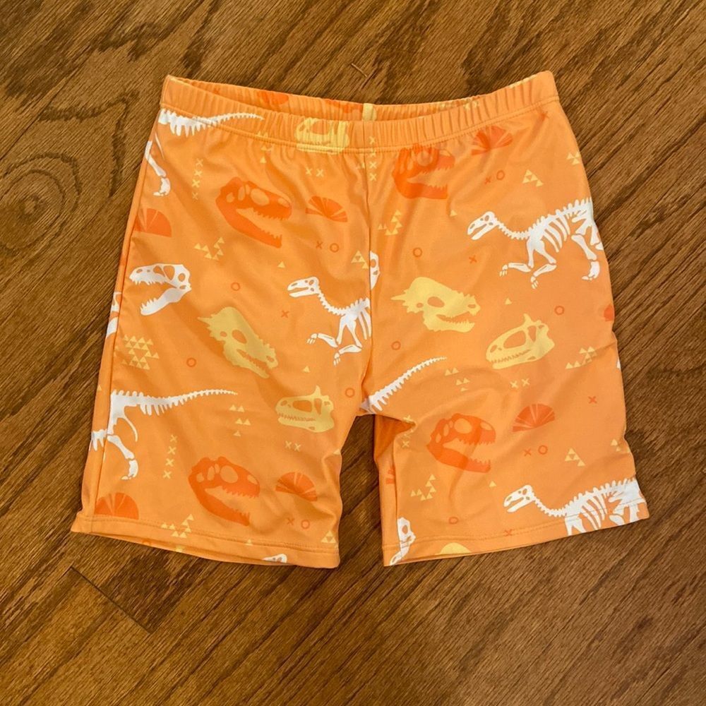 NWOT boys or girls swim shorts size 152 which is an 11/12 - dinosaurs, orange